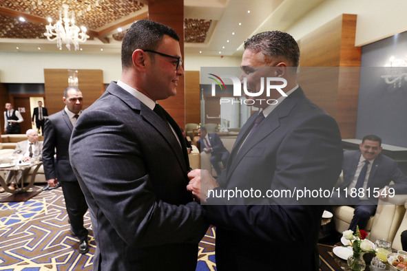 Algerian Minister of Housing Mohamed Tarek Belaribi (right) and Egyptian Minister of Housing Sherif El-Sherbiny (left) attend the 8th Arab H...