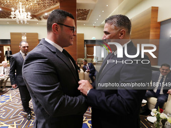 Algerian Minister of Housing Mohamed Tarek Belaribi (right) and Egyptian Minister of Housing Sherif El-Sherbiny (left) attend the 8th Arab H...