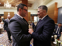 Algerian Minister of Housing Mohamed Tarek Belaribi (right) and Egyptian Minister of Housing Sherif El-Sherbiny (left) attend the 8th Arab H...