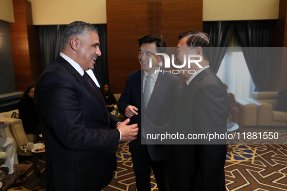 Algerian Minister of Housing Mohamed Tarek Belaribi (L) and Chinese Minister of Housing and Urban and Rural Development Ni Hong (R) attend t...