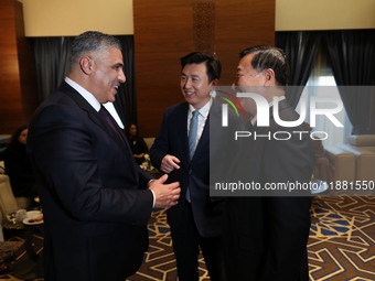 Algerian Minister of Housing Mohamed Tarek Belaribi (L) and Chinese Minister of Housing and Urban and Rural Development Ni Hong (R) attend t...