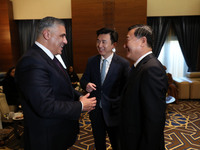 Algerian Minister of Housing Mohamed Tarek Belaribi (L) and Chinese Minister of Housing and Urban and Rural Development Ni Hong (R) attend t...