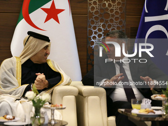 Algerian Minister of Housing Mohamed Tarek Belaribi (R) and Undersecretary General and Head of the Department of Economic Affairs at the Ara...