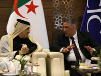 Algerian Minister of Housing Mohamed Tarek Belaribi (R) and Undersecretary General and Head of the Department of Economic Affairs at the Ara...