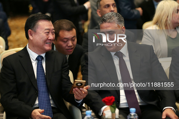 Algerian Minister of Housing Mohamed Tarek Belaribi (R) and Chinese Minister of Housing and Urban and Rural Development Ni Hong (L) attend t...