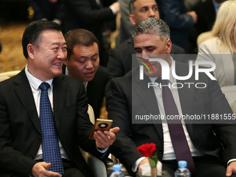 Algerian Minister of Housing Mohamed Tarek Belaribi (R) and Chinese Minister of Housing and Urban and Rural Development Ni Hong (L) attend t...