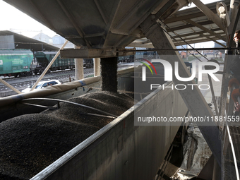 A truck is filled with sunflower seeds at a grain elevator in Chernihiv region, northern Ukraine, on December 18, 2024. (