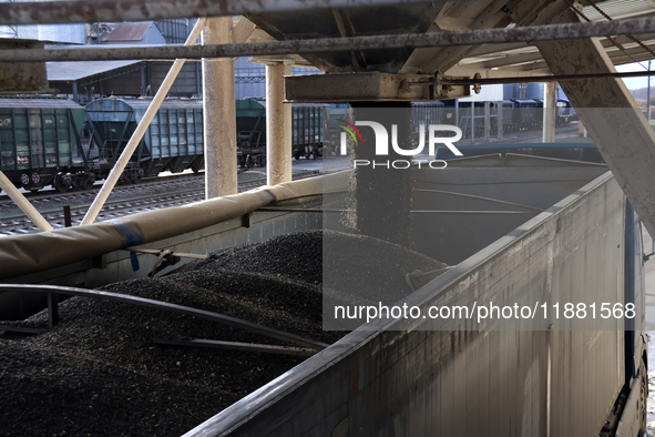 A truck is filled with sunflower seeds at a grain elevator in Chernihiv region, northern Ukraine, on December 18, 2024. 