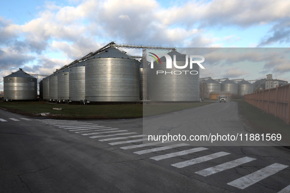 Grain bins are on the premises of a grain elevator in Chernihiv region, northern Ukraine, on December 18, 2024. 