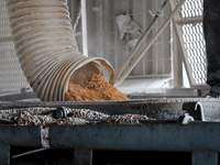 Grain is poured into a container at a grain elevator in Chernihiv region, Ukraine, on December 18, 2024. NO USE RUSSIA. NO USE BELARUS. (