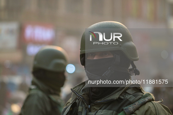 An Indian security personnel stands guard along a road in Srinagar, Jammu and Kashmir, on December 19, 2024. Indian security forces kill fiv...