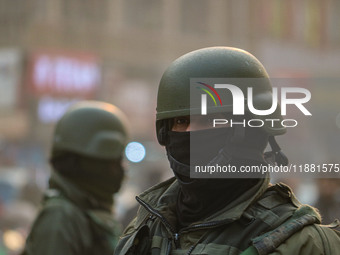 An Indian security personnel stands guard along a road in Srinagar, Jammu and Kashmir, on December 19, 2024. Indian security forces kill fiv...