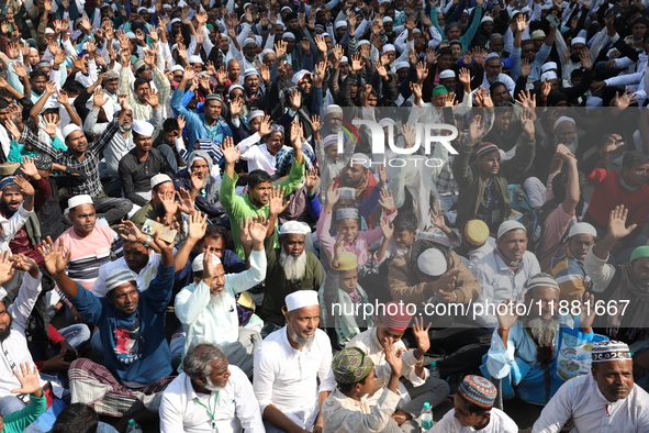 People take part in a protest meeting in Kolkata, India, on December 19, 2024, demanding the withdrawal of the Central Government's WAQF Ame...