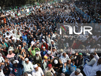 People take part in a protest meeting in Kolkata, India, on December 19, 2024, demanding the withdrawal of the Central Government's WAQF Ame...