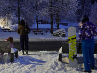 An evening scene occurs at a bus stop in Grainau, Garmisch-Partenkirchen, Bavaria, Germany, on December 13, 2024 (