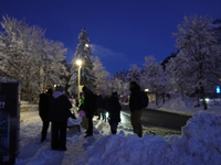 An evening scene occurs at a bus stop in Grainau, Garmisch-Partenkirchen, Bavaria, Germany, on December 13, 2024 (