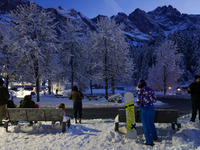 An evening scene occurs at a bus stop in Grainau, Garmisch-Partenkirchen, Bavaria, Germany, on December 13, 2024 (