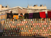 A displaced Palestinian stands in front of his tent in Deir al-Balah, on December 19, 2024, as the war between Israel and Hamas militants co...