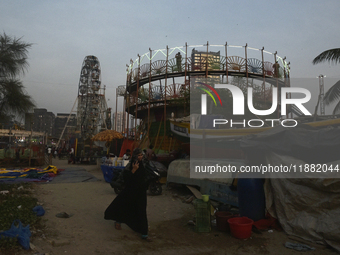 A police officer stands near a Mahim fair in Mumbai, India, on December 19, 2024. (