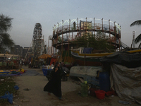 A police officer stands near a Mahim fair in Mumbai, India, on December 19, 2024. (