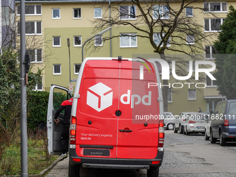 A DPD delivery van parks in front of a residential building in Munich, Bavaria, Germany, on December 19, 2024. (