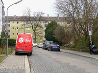 A DPD delivery van parks in front of a residential building in Munich, Bavaria, Germany, on December 19, 2024. (