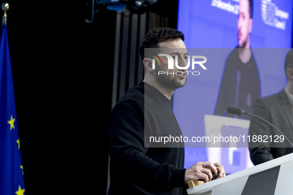 President of Ukraine Volodymyr Zelenskyy addresses a press conference during his visit at the European Council Summit, the EU leaders meetin...