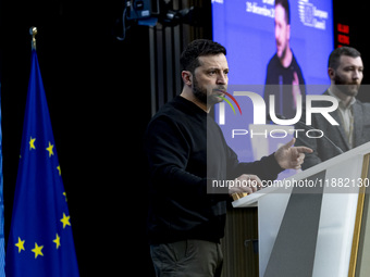 President of Ukraine Volodymyr Zelenskyy addresses a press conference during his visit at the European Council Summit, the EU leaders meetin...