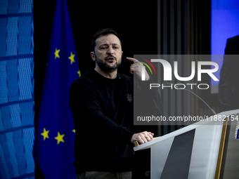 President of Ukraine Volodymyr Zelenskyy addresses a press conference during his visit at the European Council Summit, the EU leaders meetin...