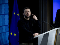 President of Ukraine Volodymyr Zelenskyy addresses a press conference during his visit at the European Council Summit, the EU leaders meetin...