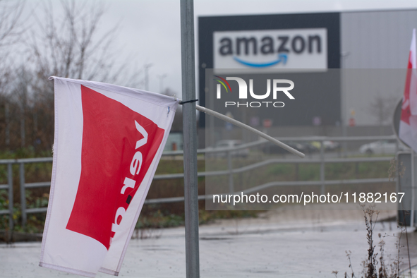 A Verdi flag is placed in front of an Amazon site in Werne, Germany, on December 19, 2024, as the Verdi labor union calls for a strike and d...