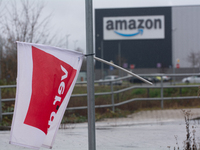 A Verdi flag is placed in front of an Amazon site in Werne, Germany, on December 19, 2024, as the Verdi labor union calls for a strike and d...