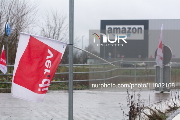 A Verdi flag is placed in front of an Amazon site in Werne, Germany, on December 19, 2024, as the Verdi labor union calls for a strike and d...