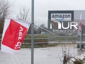 A Verdi flag is placed in front of an Amazon site in Werne, Germany, on December 19, 2024, as the Verdi labor union calls for a strike and d...