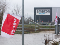 A Verdi flag is placed in front of an Amazon site in Werne, Germany, on December 19, 2024, as the Verdi labor union calls for a strike and d...