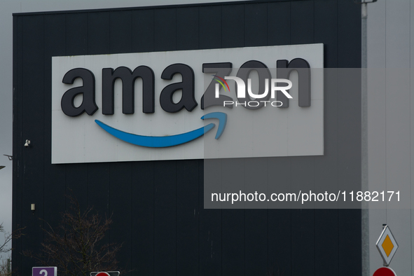 The Amazon logo is seen at a site in Werne, Germany, on December 19, 2024, as the Verdi labor union calls for a strike and demands collectiv...