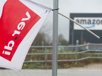 A Verdi flag is placed in front of an Amazon site in Werne, Germany, on December 19, 2024, as the Verdi labor union calls for a strike and d...