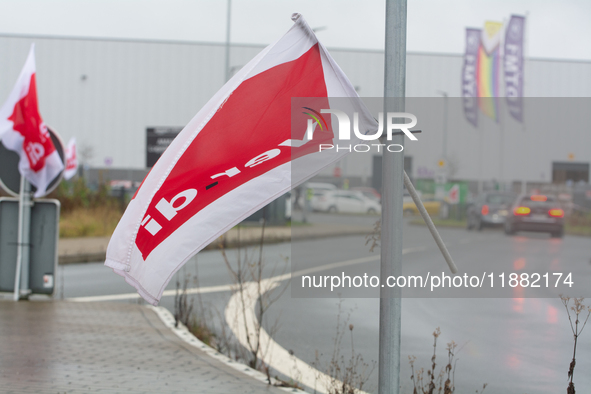 A Verdi flag is placed in front of an Amazon site in Werne, Germany, on December 19, 2024, as the Verdi labor union calls for a strike and d...