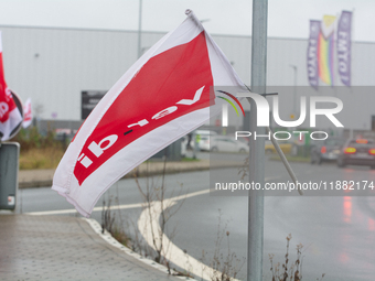 A Verdi flag is placed in front of an Amazon site in Werne, Germany, on December 19, 2024, as the Verdi labor union calls for a strike and d...