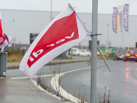 A Verdi flag is placed in front of an Amazon site in Werne, Germany, on December 19, 2024, as the Verdi labor union calls for a strike and d...