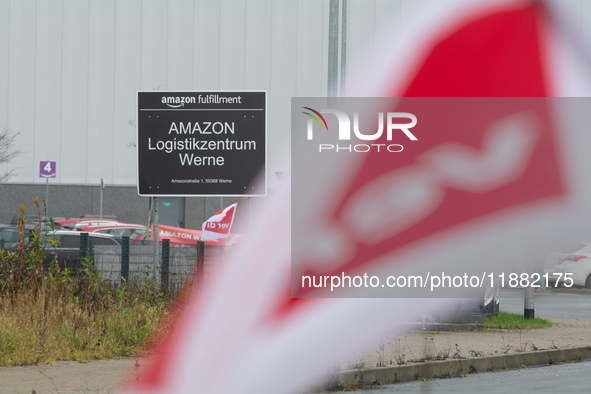 A Verdi flag is placed in front of an Amazon site in Werne, Germany, on December 19, 2024, as the Verdi labor union calls for a strike and d...