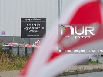 A Verdi flag is placed in front of an Amazon site in Werne, Germany, on December 19, 2024, as the Verdi labor union calls for a strike and d...