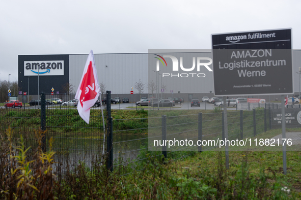 A Verdi flag is placed in front of an Amazon site in Werne, Germany, on December 19, 2024, as the Verdi labor union calls for a strike and d...