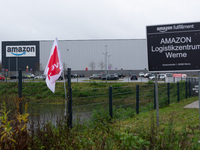 A Verdi flag is placed in front of an Amazon site in Werne, Germany, on December 19, 2024, as the Verdi labor union calls for a strike and d...