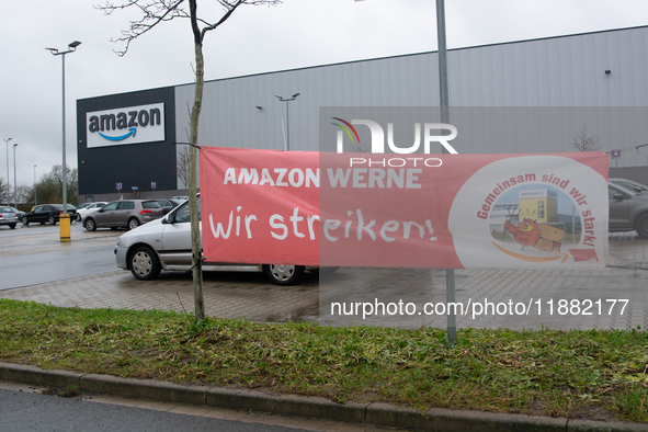 A strike banner is placed in front of an Amazon site in Werne, Germany, on December 19, 2024, as the Verdi labor union calls for a strike an...