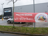 A strike banner is placed in front of an Amazon site in Werne, Germany, on December 19, 2024, as the Verdi labor union calls for a strike an...