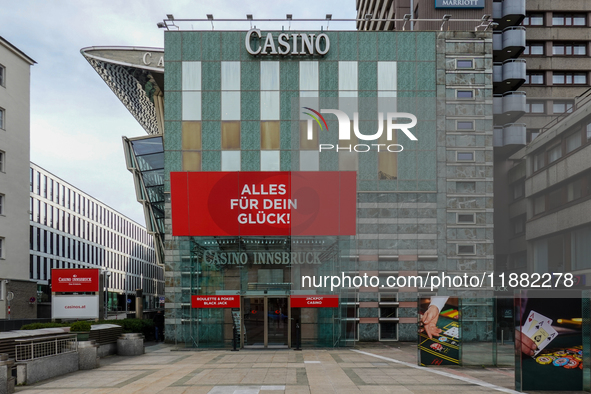 The facade of Casino Innsbruck with its red banner 'Alles fur dein Gluck!' ('Everything for your luck!') is displayed alongside promotional...