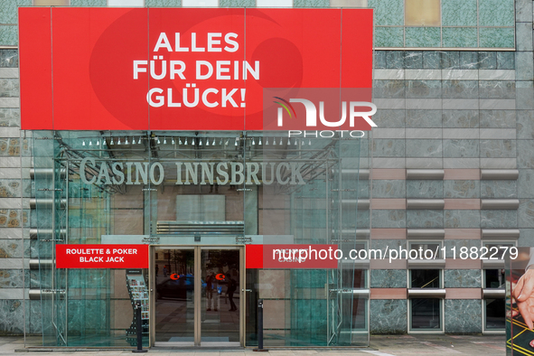 The facade of Casino Innsbruck with its red banner 'Alles fur dein Gluck!' ('Everything for your luck!') is displayed alongside promotional...