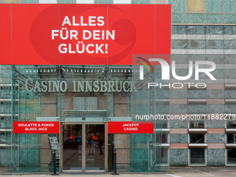 The facade of Casino Innsbruck with its red banner 'Alles fur dein Gluck!' ('Everything for your luck!') is displayed alongside promotional...