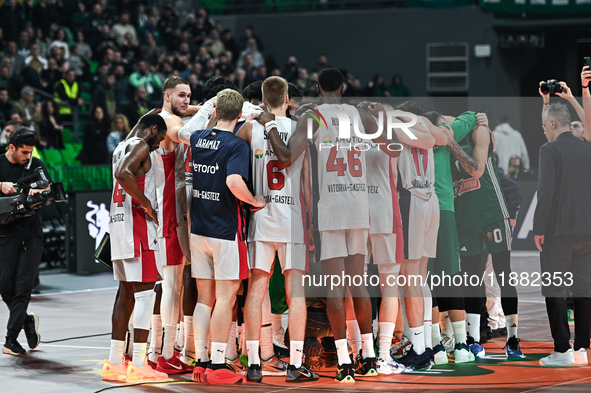 Players from Baskonia Vitoria-Gasteiz and Panathinaikos AKTOR Athens pray together for Mathias Lessort after he is injured following the Eur...